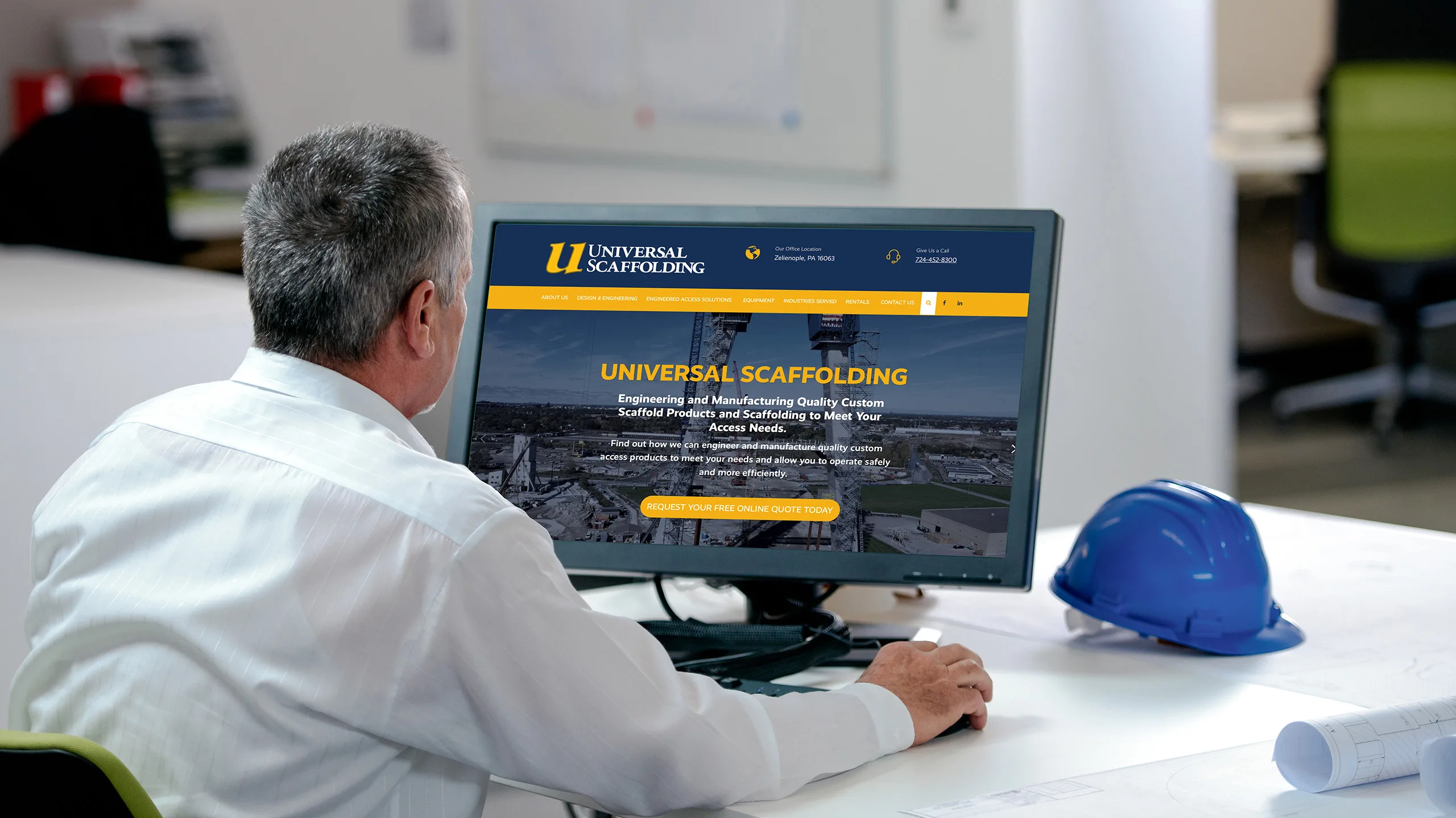Universal Scaffolding website displayed on a desktop monitor